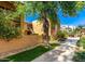 Community buildings featuring mature trees, and inviting walkways at 8500 E Indian School Rd # 233, Scottsdale, AZ 85251