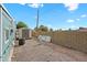 Low-maintenance backyard featuring gravel, block wall, and storage shed at 8600 E Broadway Rd # 30, Mesa, AZ 85208