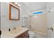 Bathroom with a well-maintained vanity, mirror, and shower-tub combo at 8600 E Broadway Rd # 30, Mesa, AZ 85208