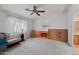 Bedroom featuring natural light, with a ceiling fan fixture, and soft carpet at 8600 E Broadway Rd # 30, Mesa, AZ 85208