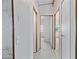 Hallway showcasing clean white walls and doors with wood trim that enhance the architectural detail at 8600 E Broadway Rd # 30, Mesa, AZ 85208