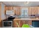 Well-equipped kitchen with stainless steel appliances and natural wood cabinetry at 8600 E Broadway Rd # 30, Mesa, AZ 85208