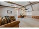 Spacious living room featuring neutral carpets, wood accents, and ample natural light at 8600 E Broadway Rd # 30, Mesa, AZ 85208