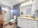 Bathroom featuring walk-in shower, granite counters, and updated fixtures at 8728 E Monte Vista Rd, Scottsdale, AZ 85257