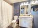 Bathroom boasts updated fixtures, granite counters, and a bathtub with shower at 8728 E Monte Vista Rd, Scottsdale, AZ 85257