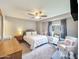 Cozy bedroom with natural light, neutral colors, and ceiling fan at 8728 E Monte Vista Rd, Scottsdale, AZ 85257