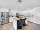 Beautiful kitchen featuring white cabinets, stainless steel appliances, granite countertops, and breakfast bar at 8728 E Monte Vista Rd, Scottsdale, AZ 85257