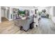 Spacious living room with an open floor plan, built in shelving, neutral paint, large couch, and tile floors at 8728 E Monte Vista Rd, Scottsdale, AZ 85257