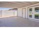 Large covered back patio features a tile floor and access to the backyard at 8802 W Monterey Way, Phoenix, AZ 85037
