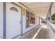 Welcoming entryway featuring a white front door, porch, and covered walkway at 8802 W Monterey Way, Phoenix, AZ 85037
