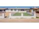 Charming single-story home featuring a well-maintained front yard and inviting curb appeal at 8802 W Monterey Way, Phoenix, AZ 85037