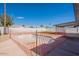 Backyard features a fenced-in pool on a sunny day, offering a private and refreshing outdoor space at 8802 W Monterey Way, Phoenix, AZ 85037
