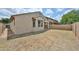 Backyard featuring block fence, patio, and view of sky and some vegetation at 9072 W Myrtle Ave, Glendale, AZ 85305