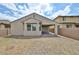A spacious backyard with patio, block fence and view of the sky at 9072 W Myrtle Ave, Glendale, AZ 85305