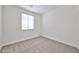 Cozy bedroom with carpet, window, and blinds creating a comfortable and private atmosphere at 9072 W Myrtle Ave, Glendale, AZ 85305