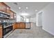 Modern kitchen features stainless steel appliances, granite countertops, and tile backsplash at 9072 W Myrtle Ave, Glendale, AZ 85305
