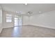 Spacious living room featuring tiled floors, abundant natural light and slider leading to the patio at 9072 W Myrtle Ave, Glendale, AZ 85305