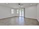 Spacious living room featuring tiled floors, abundant natural light and slider leading to the patio at 9072 W Myrtle Ave, Glendale, AZ 85305