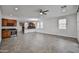 Open-concept living area with tile floors, wet bar and a view of the kitchen at 9072 W Myrtle Ave, Glendale, AZ 85305