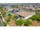 Aerial shot featuring a beautiful house, backyard pergola, and swimming pool nestled in a well-maintained community at 9157 W Country Club Trl, Peoria, AZ 85383
