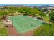 Community park featuring a well-maintained basketball court surrounded by mature trees and walking trails at 9157 W Country Club Trl, Peoria, AZ 85383