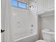 Bathroom with shower and tub combination, and efficient storage solutions at 9157 W Country Club Trl, Peoria, AZ 85383