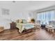 Spacious bedroom featuring hardwood floors, sitting area and decorative accents at 9157 W Country Club Trl, Peoria, AZ 85383