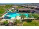 Enjoy the community pool with shade sails, seating and a splash pad, near amenities such as a ramada, restrooms and lawns at 9157 W Country Club Trl, Peoria, AZ 85383