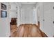 Bright entryway with wood floors, white walls, doors with sidelights and a view into multiple rooms at 9157 W Country Club Trl, Peoria, AZ 85383