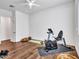 A clean exercise room featuring light-colored walls, a ceiling fan, and various exercise equipment at 9157 W Country Club Trl, Peoria, AZ 85383