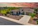 Stunning home featuring desert landscaping, tile roof, multiple garages, and a beautiful entryway at 9157 W Country Club Trl, Peoria, AZ 85383