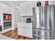 Modern kitchen with stainless steel refrigerator and built in ovens, ready for cooking at 9157 W Country Club Trl, Peoria, AZ 85383