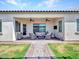 Relaxing covered patio with ceiling fans and outdoor lounge furniture at 9157 W Country Club Trl, Peoria, AZ 85383