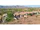 Scenic aerial view of a single-story home with a fenced backyard, offering privacy and relaxation with great views at 10109 E Trailhead Ct, Gold Canyon, AZ 85118