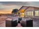 Spacious backyard has brick pavers, desert landscaping, and covered patio for outdoor relaxation at 10109 E Trailhead Ct, Gold Canyon, AZ 85118