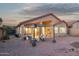 Expansive outdoor patio features an attached pergola, making it great for enjoying the desert views and sunset at 10109 E Trailhead Ct, Gold Canyon, AZ 85118