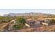 Spacious backyard with desert landscaping, patio area, and stunning mountain views at 10109 E Trailhead Ct, Gold Canyon, AZ 85118