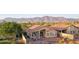Aerial backyard view featuring a patio with pergola and scenic mountain backdrop at 10109 E Trailhead Ct, Gold Canyon, AZ 85118