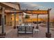 Spacious backyard patio area showcasing comfortable seating, a pergola, and desert landscaping at 10109 E Trailhead Ct, Gold Canyon, AZ 85118