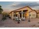 Expansive backyard patio featuring a pergola, comfortable seating, and beautifully landscaped areas at 10109 E Trailhead Ct, Gold Canyon, AZ 85118