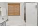 Bright bathroom featuring a soaking tub, large window, and glass shower door at 10109 E Trailhead Ct, Gold Canyon, AZ 85118