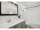 Charming bathroom with modern fixtures, stylish mirror, and tub with white tile surround at 10109 E Trailhead Ct, Gold Canyon, AZ 85118