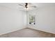 Bright bedroom with a ceiling fan and a view of the outdoors at 10109 E Trailhead Ct, Gold Canyon, AZ 85118
