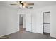 Neutral bedroom with ceiling fan, double closet, and connected room at 10109 E Trailhead Ct, Gold Canyon, AZ 85118