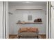 Spacious walk-in closet with ample shelving and a cozy seating area at 10109 E Trailhead Ct, Gold Canyon, AZ 85118