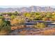 Scenic neighborhood entrance with lush desert landscaping and views of surrounding mountains at 10109 E Trailhead Ct, Gold Canyon, AZ 85118