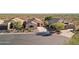 Inviting single-story home with well-maintained desert landscaping, a paved driveway, and a welcoming front entrance at 10109 E Trailhead Ct, Gold Canyon, AZ 85118