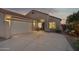 Inviting single-story home with a well-manicured lawn, desert landscaping and a welcoming entrance at 10109 E Trailhead Ct, Gold Canyon, AZ 85118