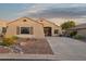 Charming single-story home featuring desert landscaping, a concrete driveway, and a cozy front porch at 10109 E Trailhead Ct, Gold Canyon, AZ 85118