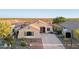 Attractive single-Gathering home with desert landscaping, long driveway, and neutral exterior at 10109 E Trailhead Ct, Gold Canyon, AZ 85118